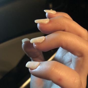Bellagio Nails & Spa - Destroyed nails. Open flesh left from filing. You can see where my nail is still supposed to be covering the skin. - Nail Salons Near Me - Gainesville, Florida
