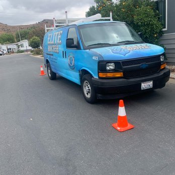 Elite Rooter - Elite Rooter van on-site, ready to provide expert plumbing services, with safety cones in place. - Plumbing Near Me - Ventura, California