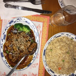 Sesame chicken and a side of fried rice Sesame chicken and a side of fried rice