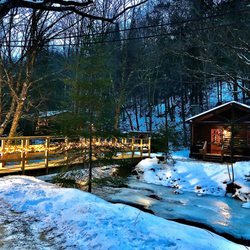 Rustic Log Cabins - Cabin #6, "Fireside". Wood burning fireplace! Full kitchen, king bed fire pit, bath and more.