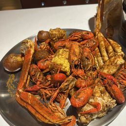 Crawfish and crab leg boil with roasted potatoes and corn Crawfish and crab leg boil with roasted potatoes and corn