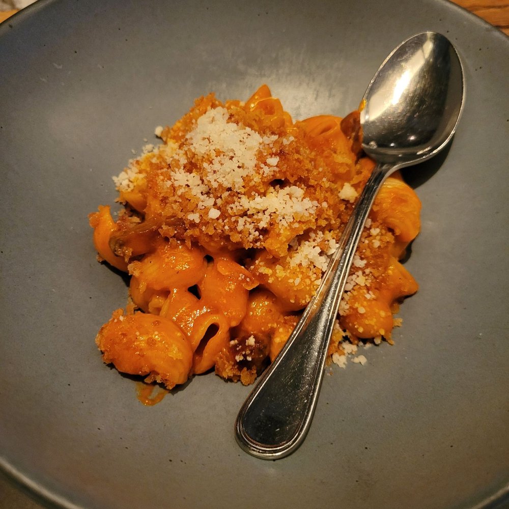 Pasquale Jones - a plate of pasta with a spoon - Italian Near Me - New York, New York Pasquale Jones - a plate of pasta with a spoon - Italian Near Me - New York, New York