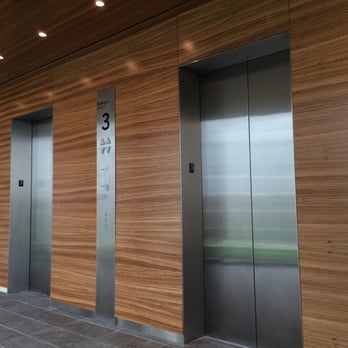 Texan Millwork - High rise elevator lobby zebra wood panels - Carpenters Near Me - Houston, Texas Texan Millwork - High rise elevator lobby zebra wood panels - Carpenters Near Me - Houston, Texas