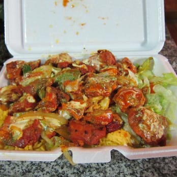 Biryani Cart - Chicken Masala over rice.  Those are big chunks of chicken, and lots of it. - Indian Near Me - New York, New York