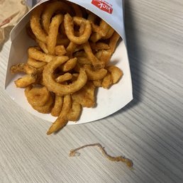 A dirty string as long as my middle finger, in my fries. Glad I didn't eat it. Im done!