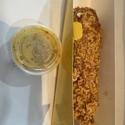 Half cheese half sausage corn dog with ramen topping and garlic parm sauce Half cheese half sausage corn dog with ramen topping and garlic parm sauce