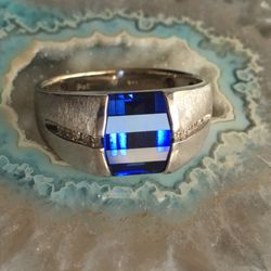 Terry's Touch Of Gold - This guy is a lab created blue sapphire, but still real and gorgeous, affordable at well under thousand, instead of 3 grand Up!