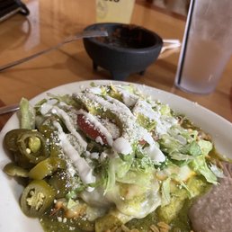 Green sauce enchiladas, beans, rice. Notice salsa is gone and margarita is half full! YUMMO!