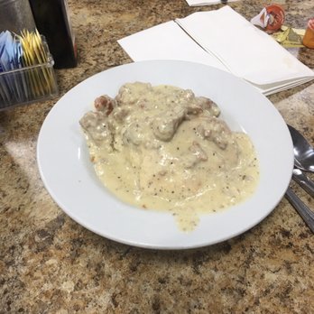 Carolyn's Cafe - The biscuit & gravy that came with my meal. Can you SEE the chunks of sausage?? It does have a teeny weeny spicy 'bite' to it. - Breakfast & Brunch Near Me - Redlands, California Carolyn's Cafe - The biscuit & gravy that came with my meal. Can you SEE the chunks of sausage?? It does have a teeny weeny spicy 'bite' to it. - Breakfast & Brunch Near Me - Redlands, California