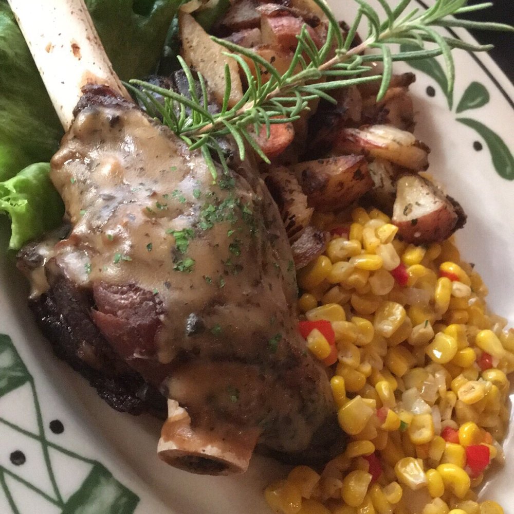 1424 Bistro - Roasted lamb shank with Greek potatoes and sauté corn $18 - Seafood Near Me - Waco, Texas 1424 Bistro - Roasted lamb shank with Greek potatoes and sauté corn $18 - Seafood Near Me - Waco, Texas