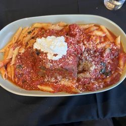 Barcellos Family Restaurant - O'pulputtone, Prosciutto and mozzarella stuffed meatball topped with ricotta and served with pasta.