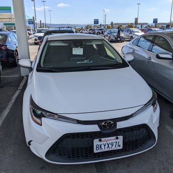 Alamo Rent A Car - "Intermediate Car" Toyota Corolla. White. I think the model year was 2022, but maybe it's 2021. I don't know. - Car Rental Near Me - Oakland, California Alamo Rent A Car - "Intermediate Car" Toyota Corolla. White. I think the model year was 2022, but maybe it's 2021. I don't know. - Car Rental Near Me - Oakland, California