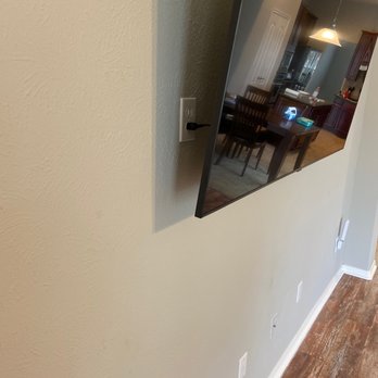 Cruz Electric - Plug installed behind the TV. - Electricians Near Me