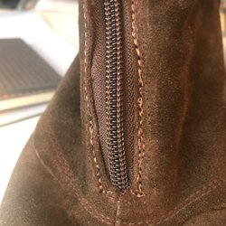 Eckstein Shoe Store - Horrible orange stitching and BULGING zipper.
