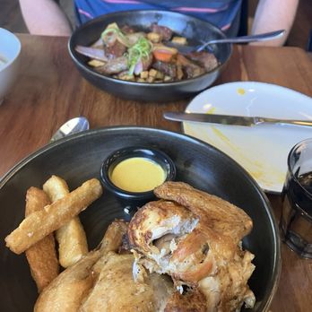 Limón - Half chicken. Yucca fries. Amarillo sauce. Lomo saltado in the back - Peruvian Near Me - Mountain View, California
