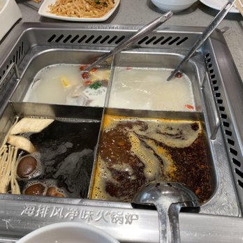 Haidilao Hotpot Flushing - 4 different soup bases- seafood, mala spicy, mushroom and pork bone (clockwise) - Hot Pot Near Me - Flushing, New York Haidilao Hotpot Flushing - 4 different soup bases- seafood, mala spicy, mushroom and pork bone (clockwise) - Hot Pot Near Me - Flushing, New York