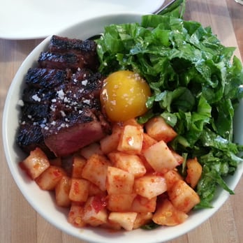 Revel - Short rib, sambal daikon, mustard green rice dish with egg yolk. $14. - Korean Near Me - Seattle, Washington