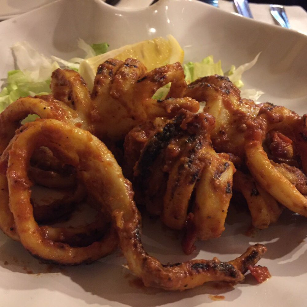 Perfectly cooked calamari. Grilled, amazing sauce. Perfectly cooked calamari. Grilled, amazing sauce.