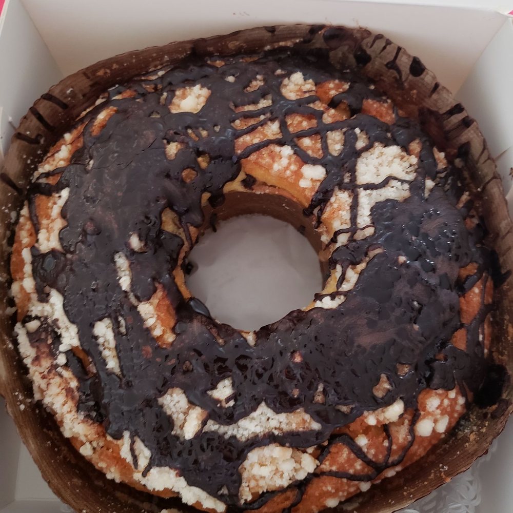 Sour cream cake with chocolate chips. Pound cake like texture with quality chocolate drizzle over.