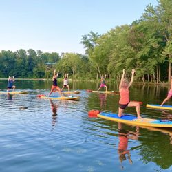 Shaka Fitness - SUP yoga at Coe Lake.  Be a warrior on the water!