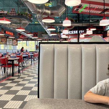 Portillo's Madison, Wisconsin - West Towne - a young boy sitting at a booth - Hot Dogs Near Me - Madison, Wisconsin