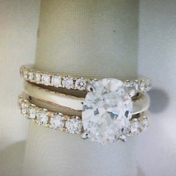 Lawrence Jewelers - Close up of the two wedding bands from Lawrence. Top band 1/4 carat, bottom band 1/2 carat. Both are from the "Love Story" collection. - Jewelry Near Me - Fort Gratiot, Michigan Lawrence Jewelers - Close up of the two wedding bands from Lawrence. Top band 1/4 carat, bottom band 1/2 carat. Both are from the "Love Story" collection. - Jewelry Near Me - Fort Gratiot, Michigan