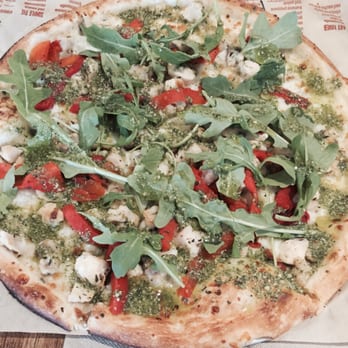 Blaze Pizza - Green Stripe Pizza: Pesto drizzle over chicken, red peppers, garlic, mozzarella, arugula - Pizza Near Me - Cabazon, California Blaze Pizza - Green Stripe Pizza: Pesto drizzle over chicken, red peppers, garlic, mozzarella, arugula - Pizza Near Me - Cabazon, California