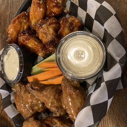 The Warehouse Tavern & Grill - Wings with Thai peanut sauce and sweet chili sauce.