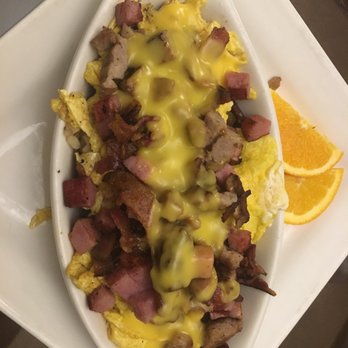 Grapevine Café - Hearty Scramble...bacon, sausage and ham with scrambled eggs and hollandaise over hash browns...yum! - Breakfast & Brunch Near Me - Green Bay, Wisconsin Grapevine Café - Hearty Scramble...bacon, sausage and ham with scrambled eggs and hollandaise over hash browns...yum! - Breakfast & Brunch Near Me - Green Bay, Wisconsin