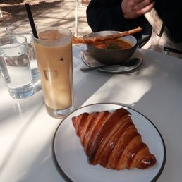 Banana bread latte, sourdough croissant, and soup Banana bread latte, sourdough croissant, and soup