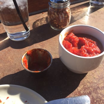 Taverna Rossa - Left: received when I asked for extra red sauce. Right: received once the first extra serving was gone after one slice. - Pizza Near Me - Plano, Texas Taverna Rossa - Left: received when I asked for extra red sauce. Right: received once the first extra serving was gone after one slice. - Pizza Near Me - Plano, Texas