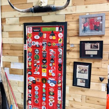Downey Brewing Company - a red door with stickers on it - Breweries Near Me - Dearborn, Michigan