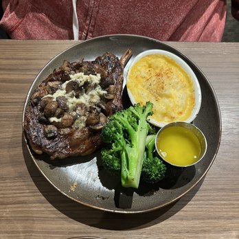 Black Angus Steakhouse - 18oz rib-eye mushrooms and garlic herb butter - Steakhouses Near Me - Lancaster, California Black Angus Steakhouse - 18oz rib-eye mushrooms and garlic herb butter - Steakhouses Near Me - Lancaster, California