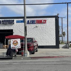 Bacon Wrapped - She's in front of Harbor Truck Parts in Long Beach. Cross streets are Anaheim St. & Harbor Ave