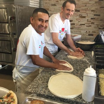 Italia Express - So busy they stopped and smiled for me! They were literally still needing the dough when I took this! - Italian Near Me - Allen, Texas Italia Express - So busy they stopped and smiled for me! They were literally still needing the dough when I took this! - Italian Near Me - Allen, Texas