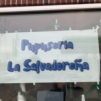 Pupuseria La Salvadoreña - a sign in a window - Salvadoran Near Me - Indianapolis, Indiana