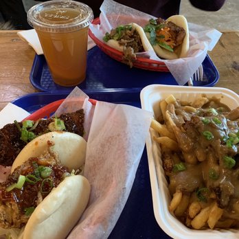 Bao Bar Mississauga - Back: Thai yum pork bao, crackle belly bao Front (L): chicken katsu, Korean garlic chicken, (R) dynasty duck poutine - Sandwiches Near Me - Mississauga, Ontario Bao Bar Mississauga - Back: Thai yum pork bao, crackle belly bao Front (L): chicken katsu, Korean garlic chicken, (R) dynasty duck poutine - Sandwiches Near Me - Mississauga, Ontario