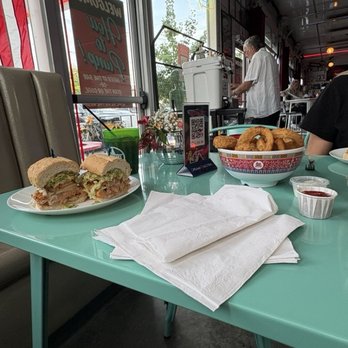 The Pump Bar - Tulsa - 8" Catfish Po Boy and Onion Ring Basket - Bars Near Me - Tulsa, Oklahoma The Pump Bar - Tulsa - 8" Catfish Po Boy and Onion Ring Basket - Bars Near Me - Tulsa, Oklahoma