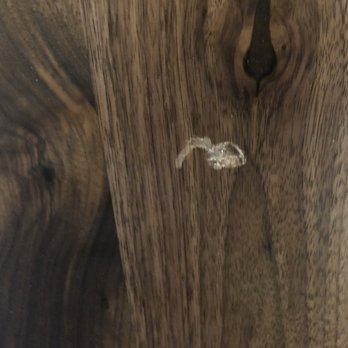 UPLIFT Desk & Human Solution - This was the damage to the first desktop to arrive. This was in the center of the work space. Unsightly and unusable. - Furniture Stores Near Me - Austin, Texas
