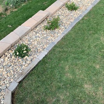 SES Landscape - a garden with a stone edging - Landscaping Near Me SES Landscape - a garden with a stone edging - Landscaping Near Me