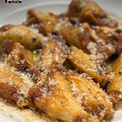 Garlic Parm Wings at Abe's Place--crispy, cheesy, and packed with flavor.