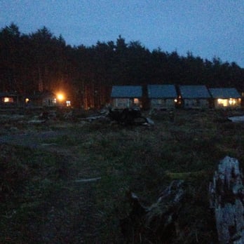 Quileute Oceanside Resort - View of cabins from beach at night. - Hotels Near Me - La Push, Washington Quileute Oceanside Resort - View of cabins from beach at night. - Hotels Near Me - La Push, Washington