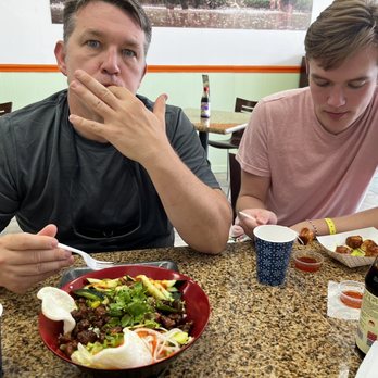 Saigon Sizzle - Piggie rice box (sweet and savory) and my son had the crab dumplings, which he would not share. - Vietnamese Near Me - Orange City, Florida