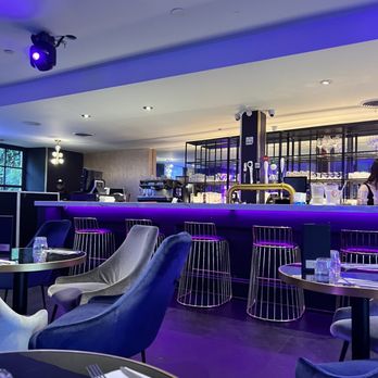 Trône - a bar with purple lighting and blue chairs - Bars Near Me - Montreal, Quebec Trône - a bar with purple lighting and blue chairs - Bars Near Me - Montreal, Quebec
