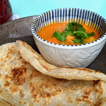 Ruby Chow's - Roti Canai. Flaky flat bread, chicken, Malaysian curry dipping sauce. $6. - Asian Fusion Near Me - Atlanta, Georgia