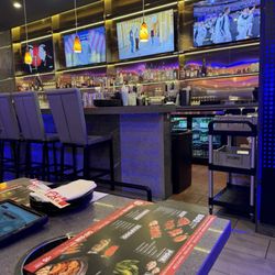KPOT Korean BBQ & Hot Pot - Table and bar