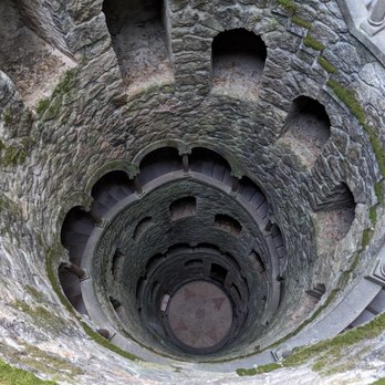 Quinta da Regaleira - Looking down the Initiation Well at the Quinta da Regaleira - Landmarks & Historical Buildings Near Me - Sintra, 11 Quinta da Regaleira - Looking down the Initiation Well at the Quinta da Regaleira - Landmarks & Historical Buildings Near Me - Sintra, 11