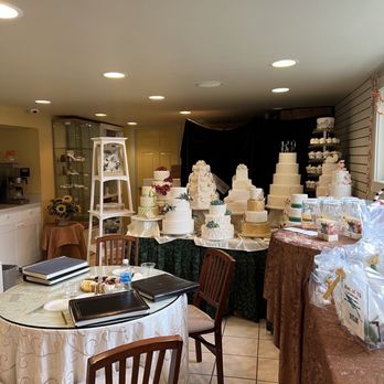 Cakes By Creme de la Creme - a table with a cake on it - Patisserie/Cake Shop Near Me - Renton, Washington Cakes By Creme de la Creme - a table with a cake on it - Patisserie/Cake Shop Near Me - Renton, Washington