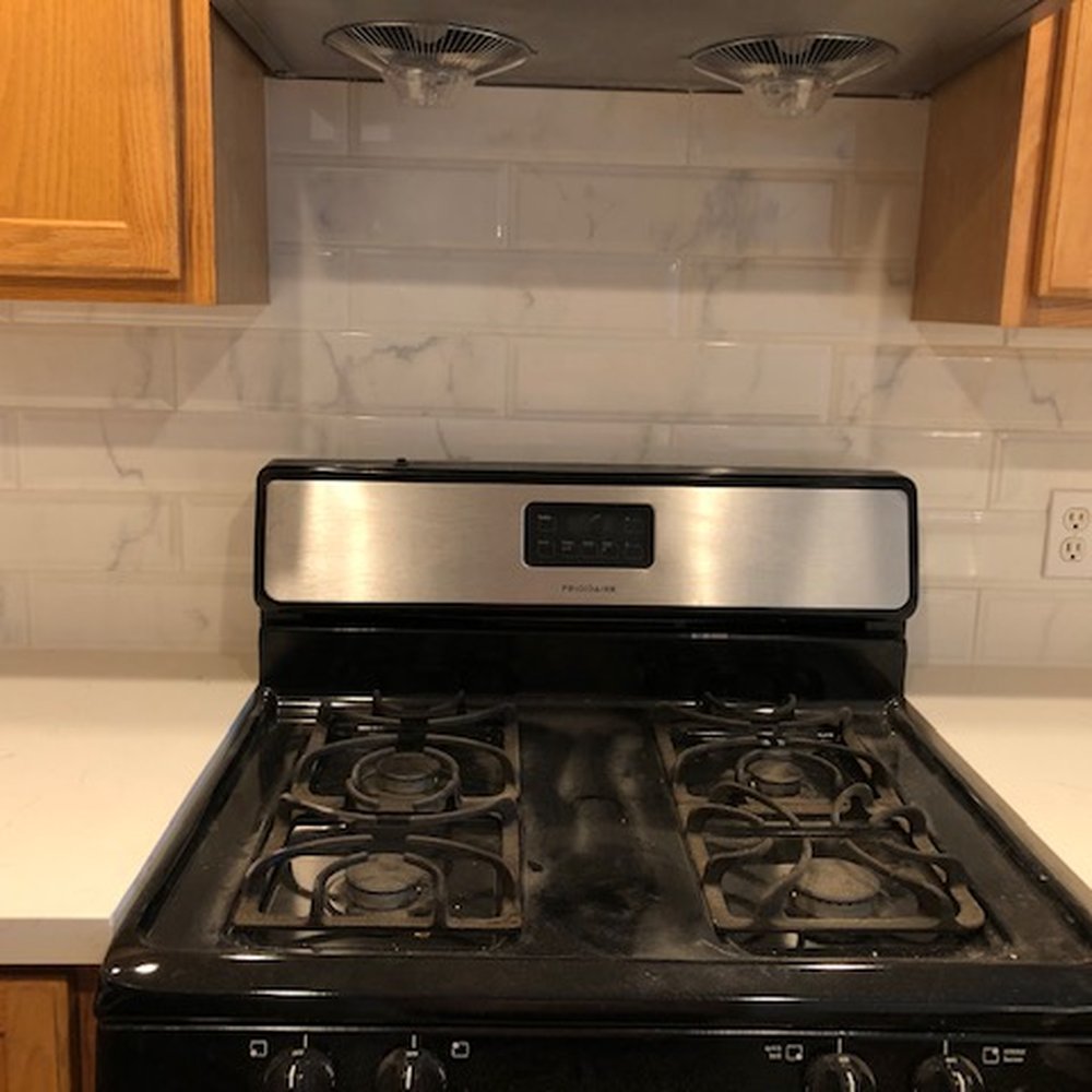 ABS Cabinets - Even grouting even in the back of the stove. - Cabinetry Near Me - Seattle, Washington