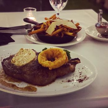 Chicago Chop House - Wet-Aged Bone-In Ribeye Roasted Garlic Butter Hand Cut French Fries - Steakhouses Near Me - Chicago, Illinois